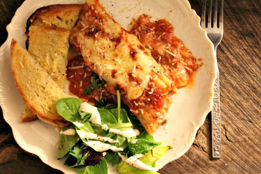 Want all the lasagna flavor without lasagna effort? Try this beef and ricotta stuffed manicotti recipe topped with homemade sauce and melted mozzarella.
