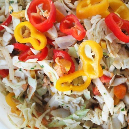 Fresh & colorful, this spicy and crunchy Jamaican Slaw Recipe is a flavor-packed side dish. Sweet and bright peppers with healthy cabbage.