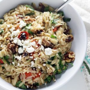 Orzo pasta tossed in a tangy lemon-honey dressing, fire roasted tomatoes, feta, and spinach.