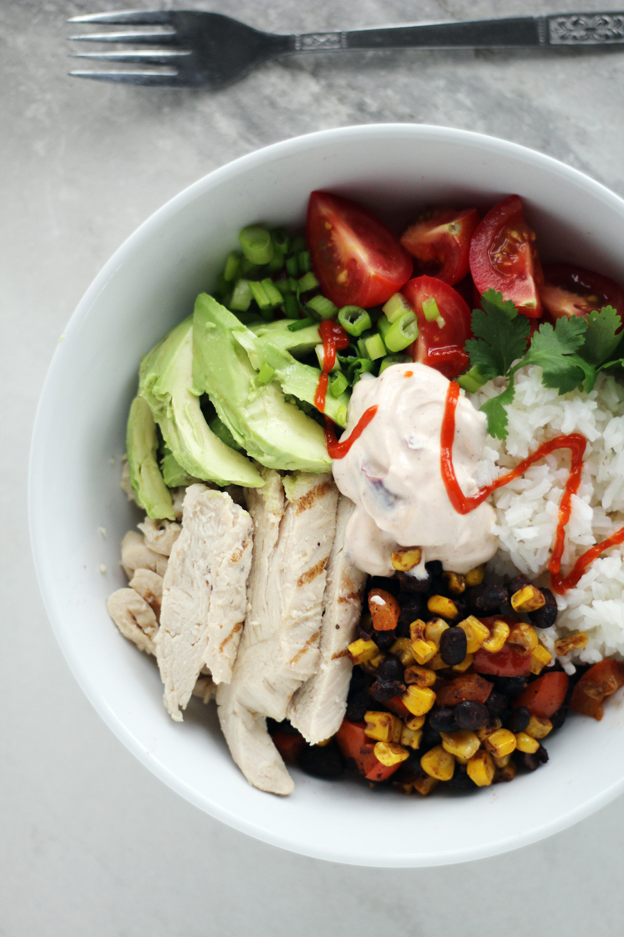 Fresh avocado, grilled chicken, black beans, corn and more are the perfect combination for chicken avocado bowls.