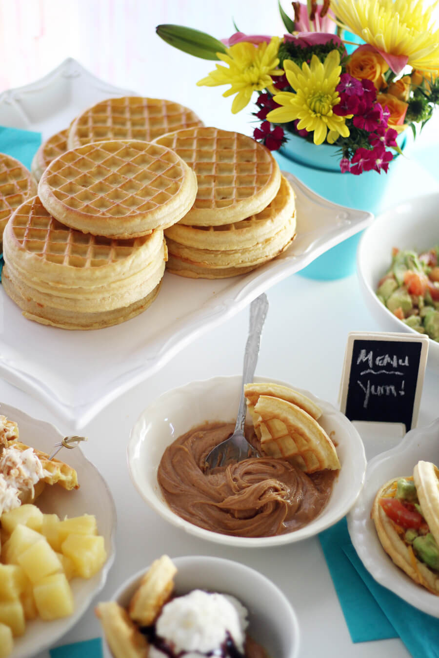 A picture of a white platter with stacks of waffles