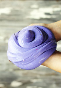 A large bundle of purple slime with glitter in it