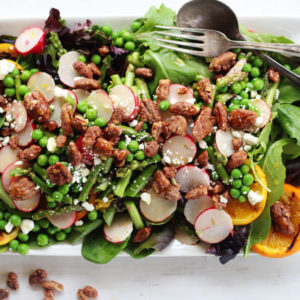 This healthy Grilled Citrus Spring Salad is loaded with seasonal asparagus, sliced radishes, and peas. Plus extra flavor from feta cheese and glazed pecans.