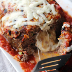 Meatloaf stuffed with melted mozzarella cheese and topped with tomato sauce