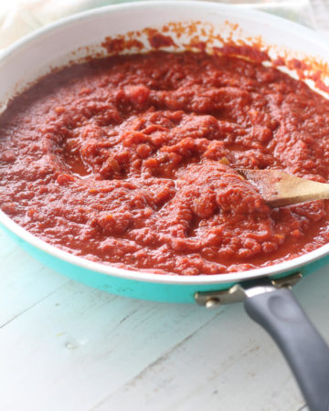 a skillet with tomato sauce