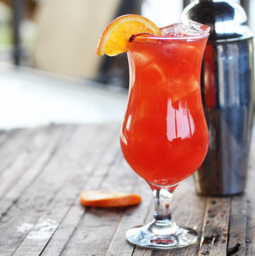 a fruity, tropical hurricane drink in a tall glass