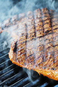 seared steak on a grill