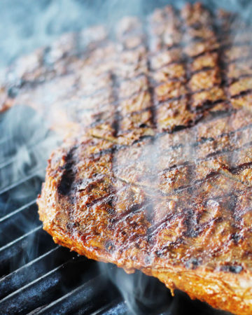 seared steak on a grill